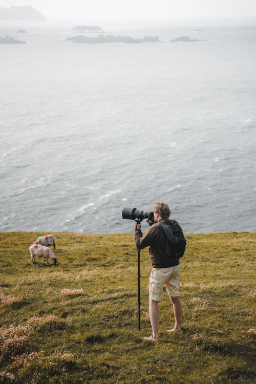 Cliff Reed Photography Photographer Capturing Seaside Landscape on Cliff · Free Stock Photo