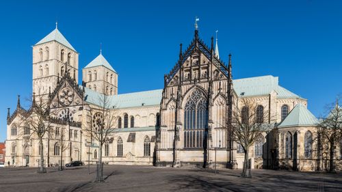Free Front view of the historic St. Paulus Cathedral under clear blue skies in Münster, Germany. Stock Photo