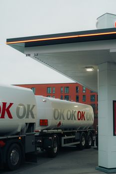 Fuel tanker truck at a modern gas station in Copenhagen, Denmark.