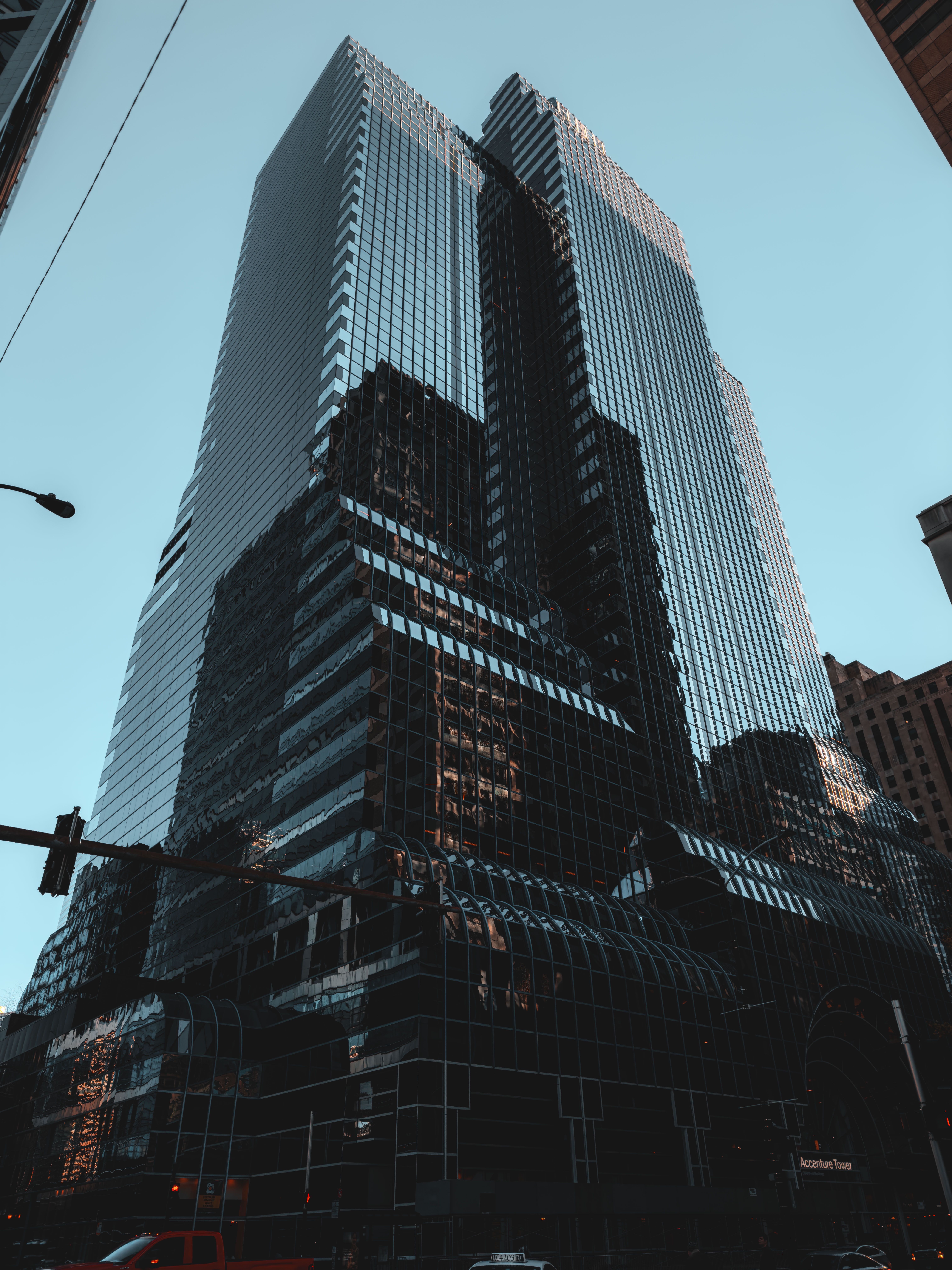 Modern Glass Skyscraper Under Clear Blue Sky · Free Stock Photo