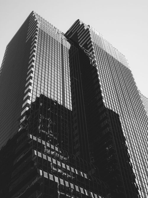 Free Black and white photo of modern skyscrapers showcasing urban architecture. Stock Photo