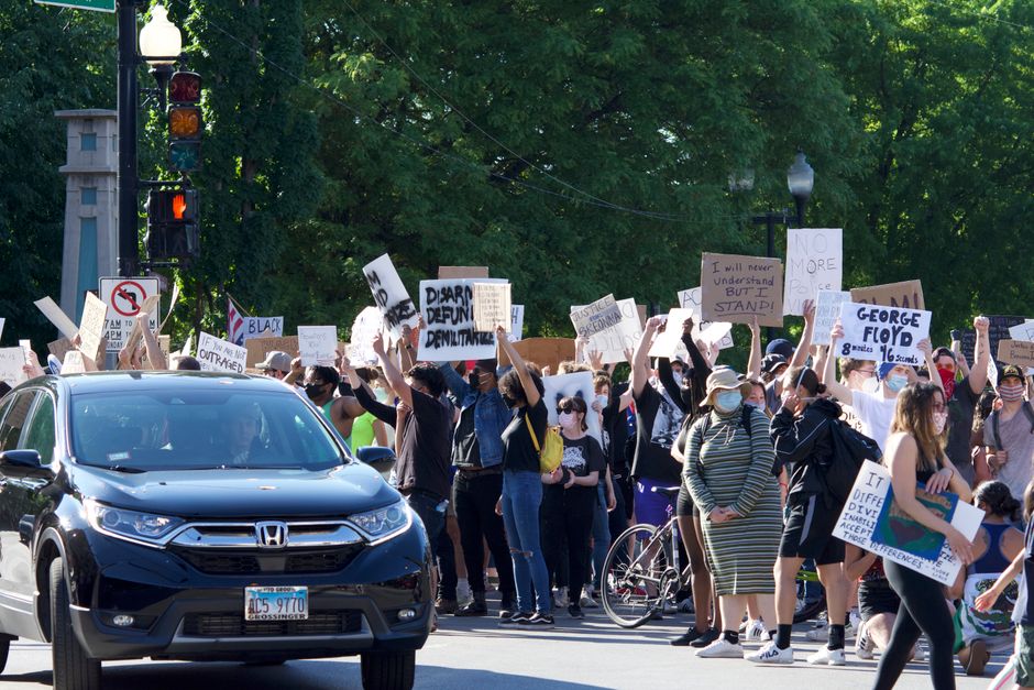 drivers outside cars protest