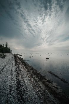 Rocky beach at Spithami, Estonia with dramatic skies and serene waters.