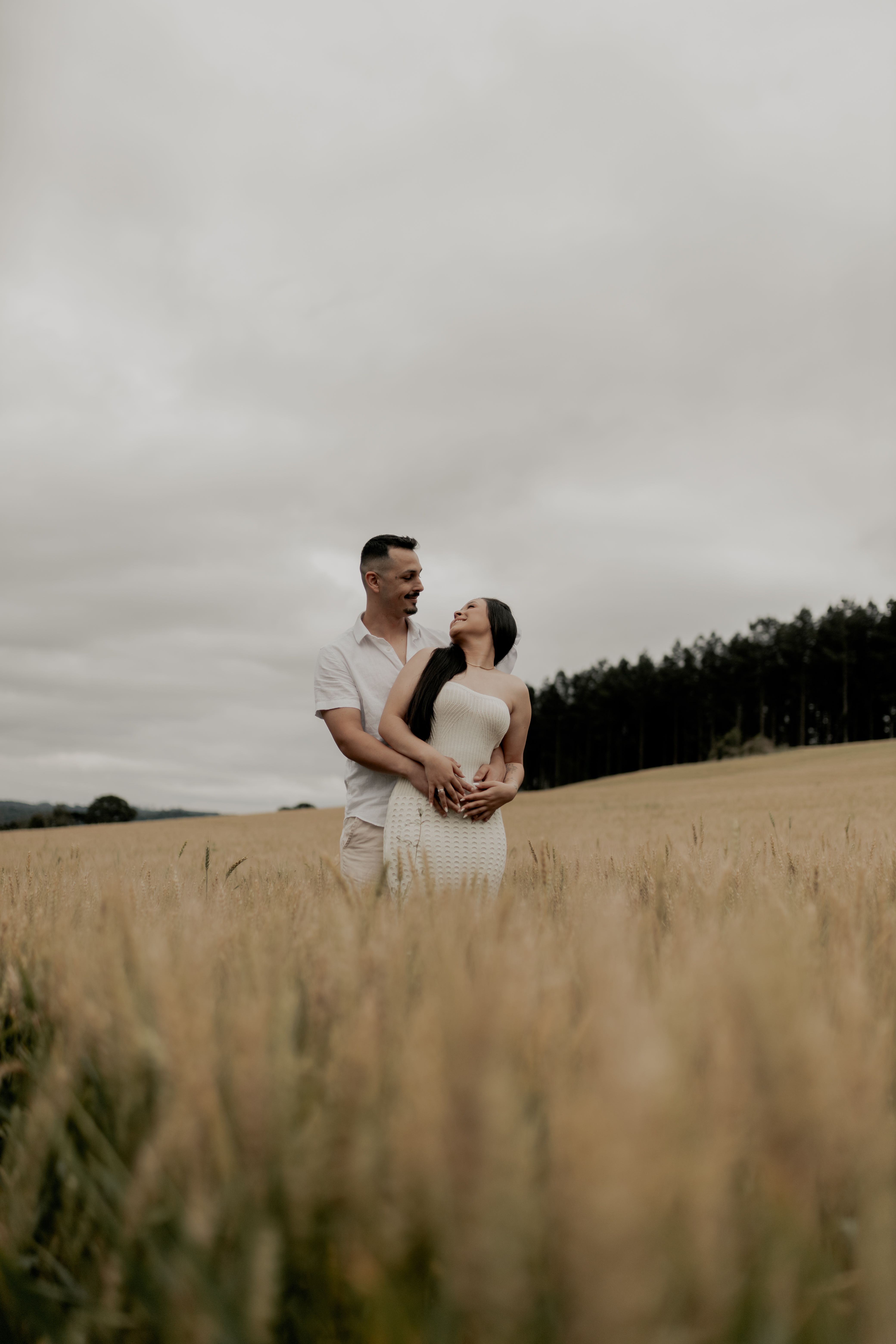 Couple Embracing in a Serene Wheat Field · Free Stock Photo