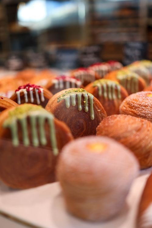 Free A mouth-watering display of pastries topped with colorful glaze in a bakery. Stock Photo