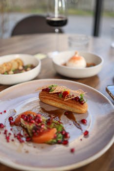 Delicious gourmet dessert with artistic presentation on a dining table.