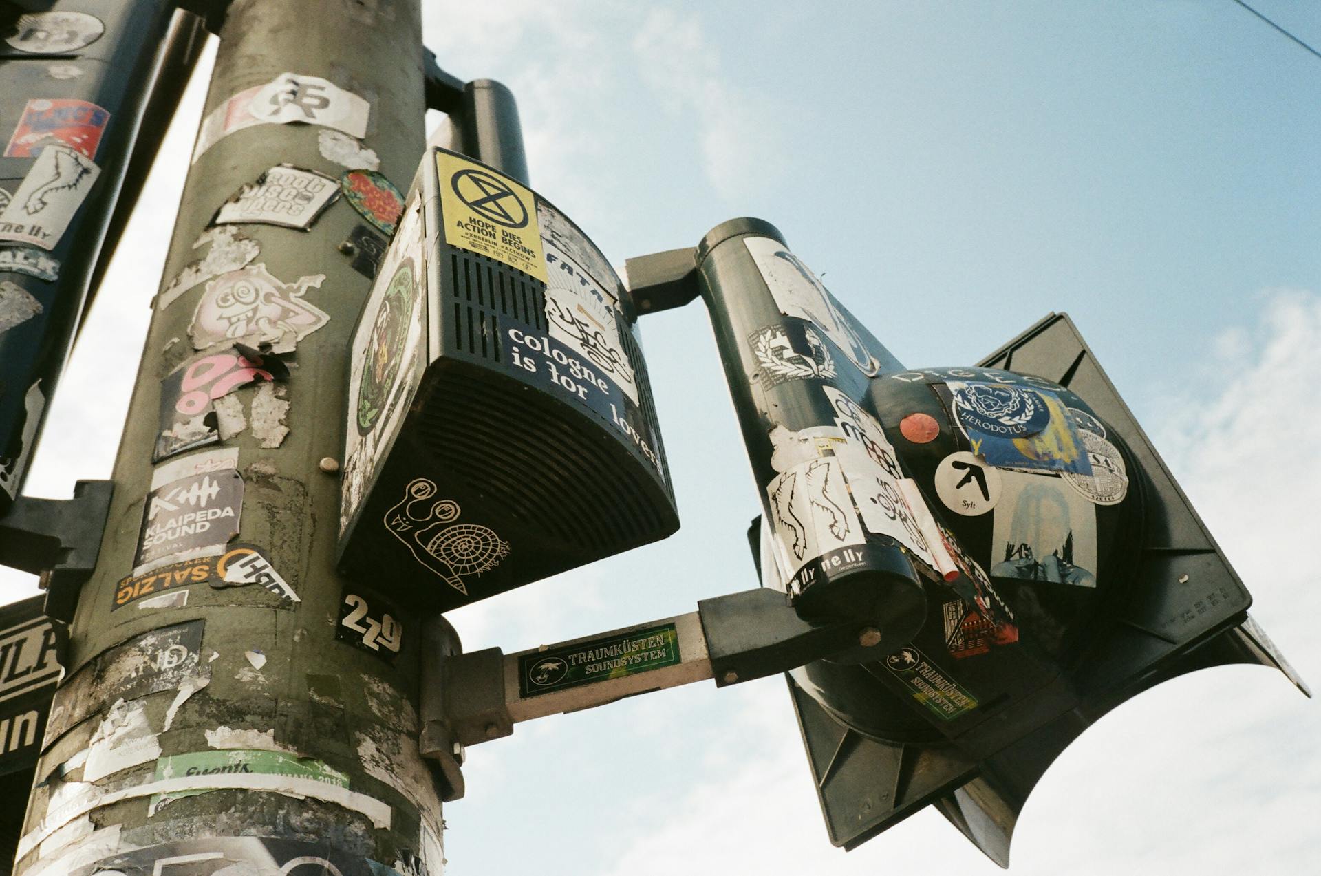 Low-Angle Photo of Stickers on a Post