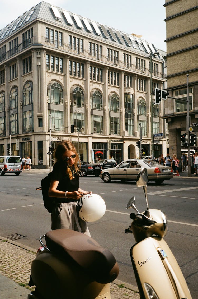 Woman Holding Helmet