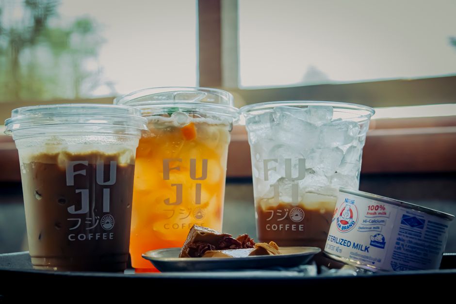 Chilled drinks with ice, coffee, and tea from Fuji Coffee, served indoors.