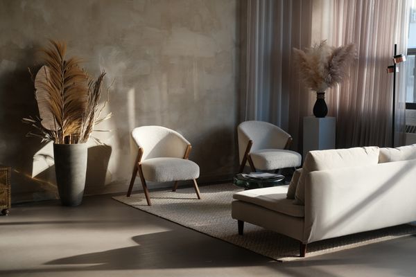 Living room with a reading chair and natural light in Sant Gervasi