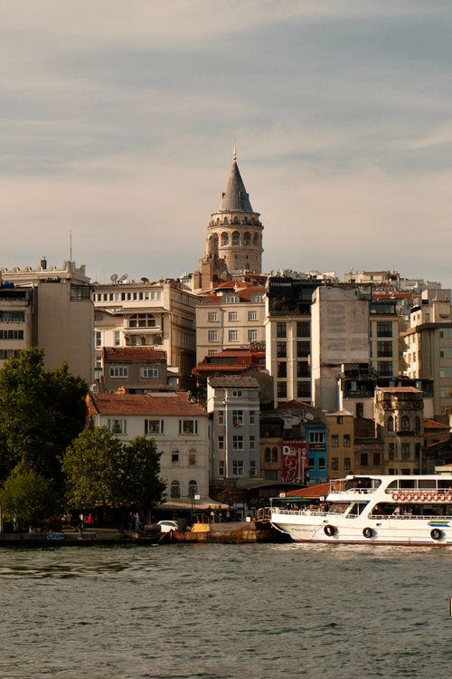 Free Picturesque view of the historic Galata Tower with the serene waterside setting in Istanbul, Turkey. Stock Photo