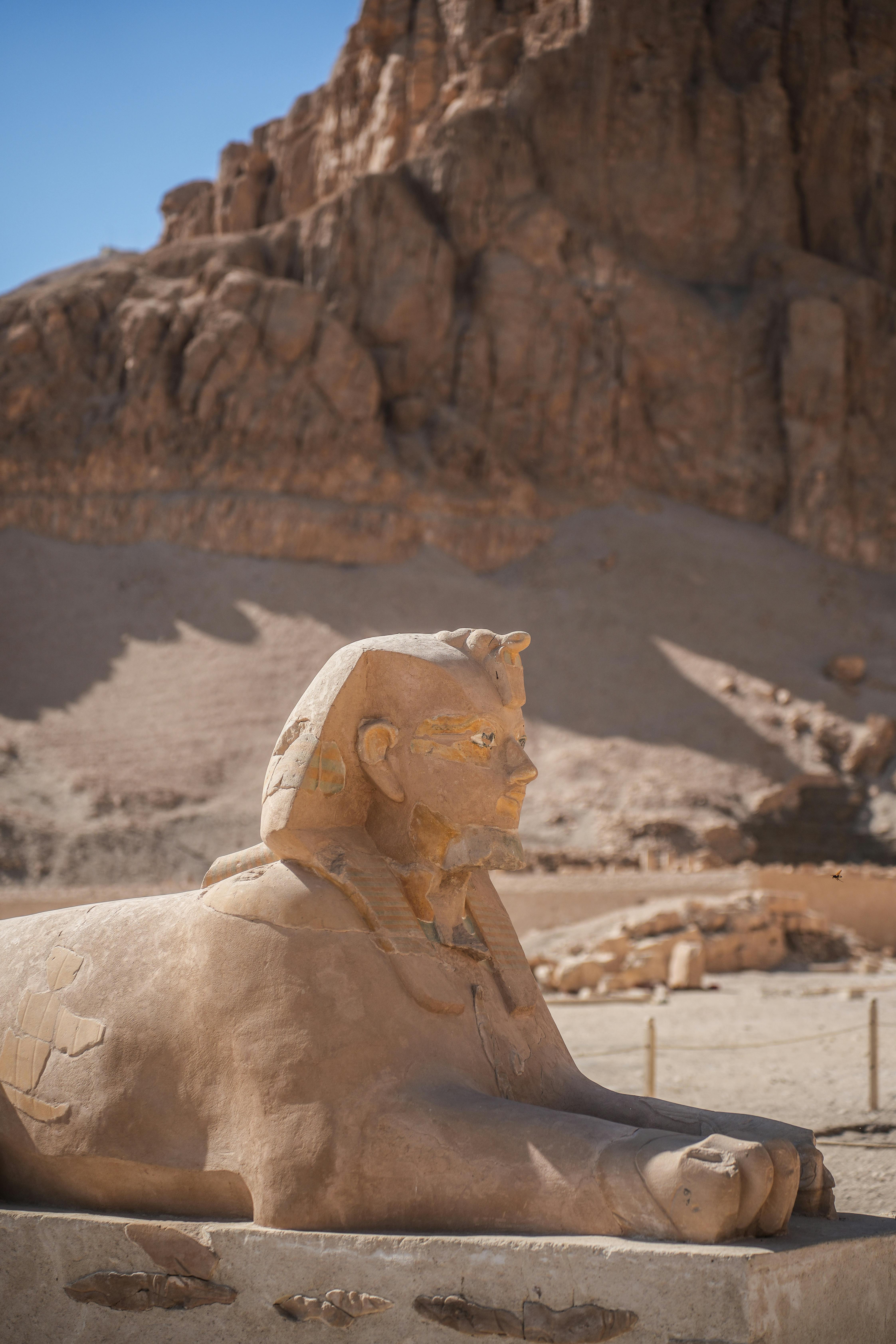 ancient egyptian sphinx statue in desert landscape