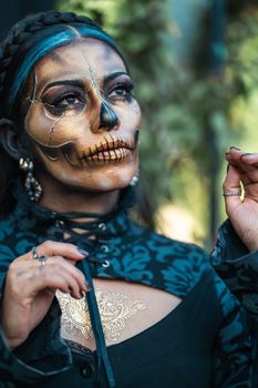 A woman with Catrina makeup for Dia de los Muertos in Mexico City.