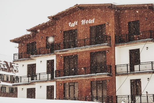 Loft Hotel covered in snowy charm during winter in Bakuriani, Georgia.