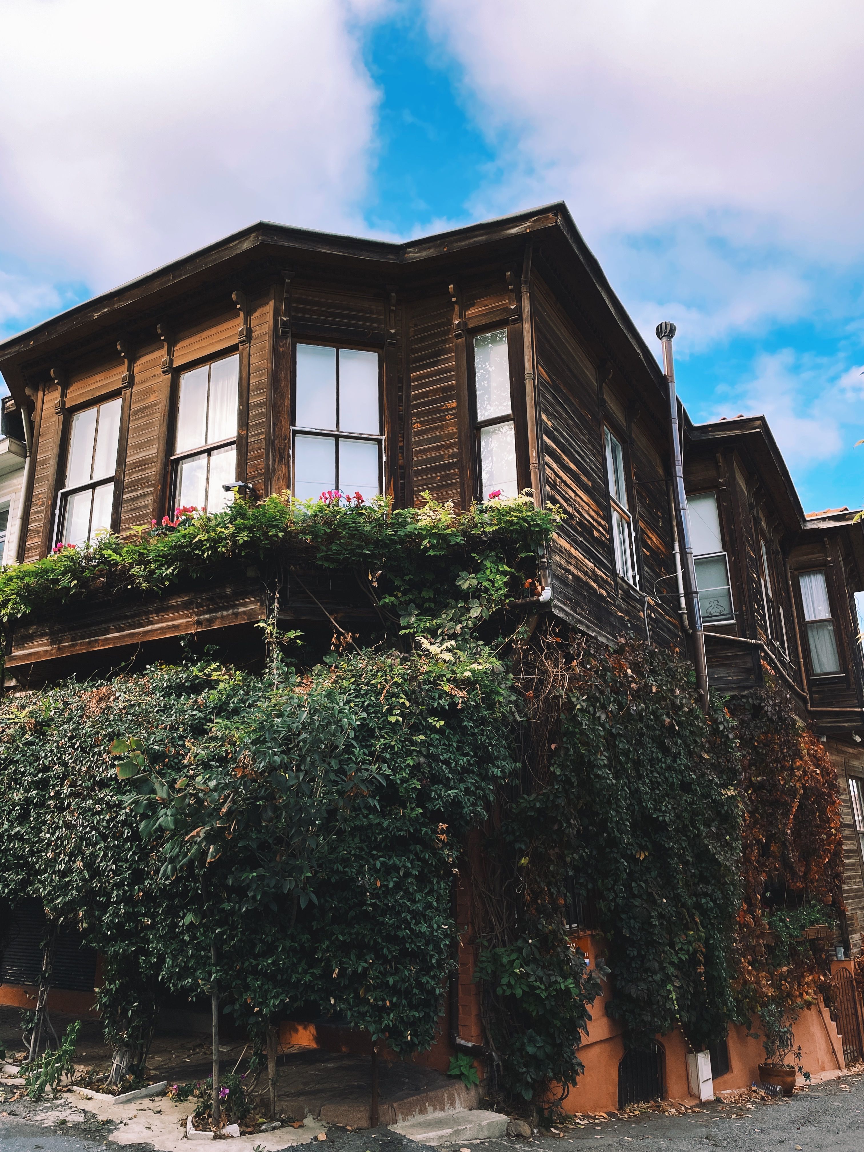 Charming Wooden House with Lush Greenery · Free Stock Photo