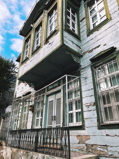 Free Charming weathered house with ornate ironwork in a traditional style. Stock Photo