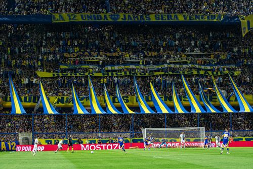 Free Crowded soccer stadium with energetic fans and intense gameplay on the field. Stock Photo