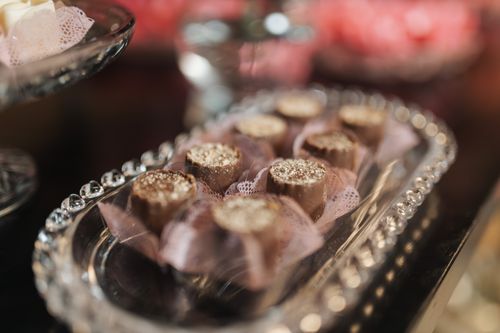 Free Close-up of gourmet chocolate desserts elegantly arranged on a crystal tray, perfect for festive occasions. Stock Photo