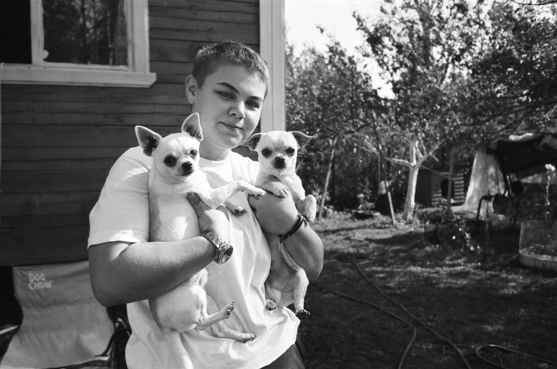 Person Carrying Two Chihuahua