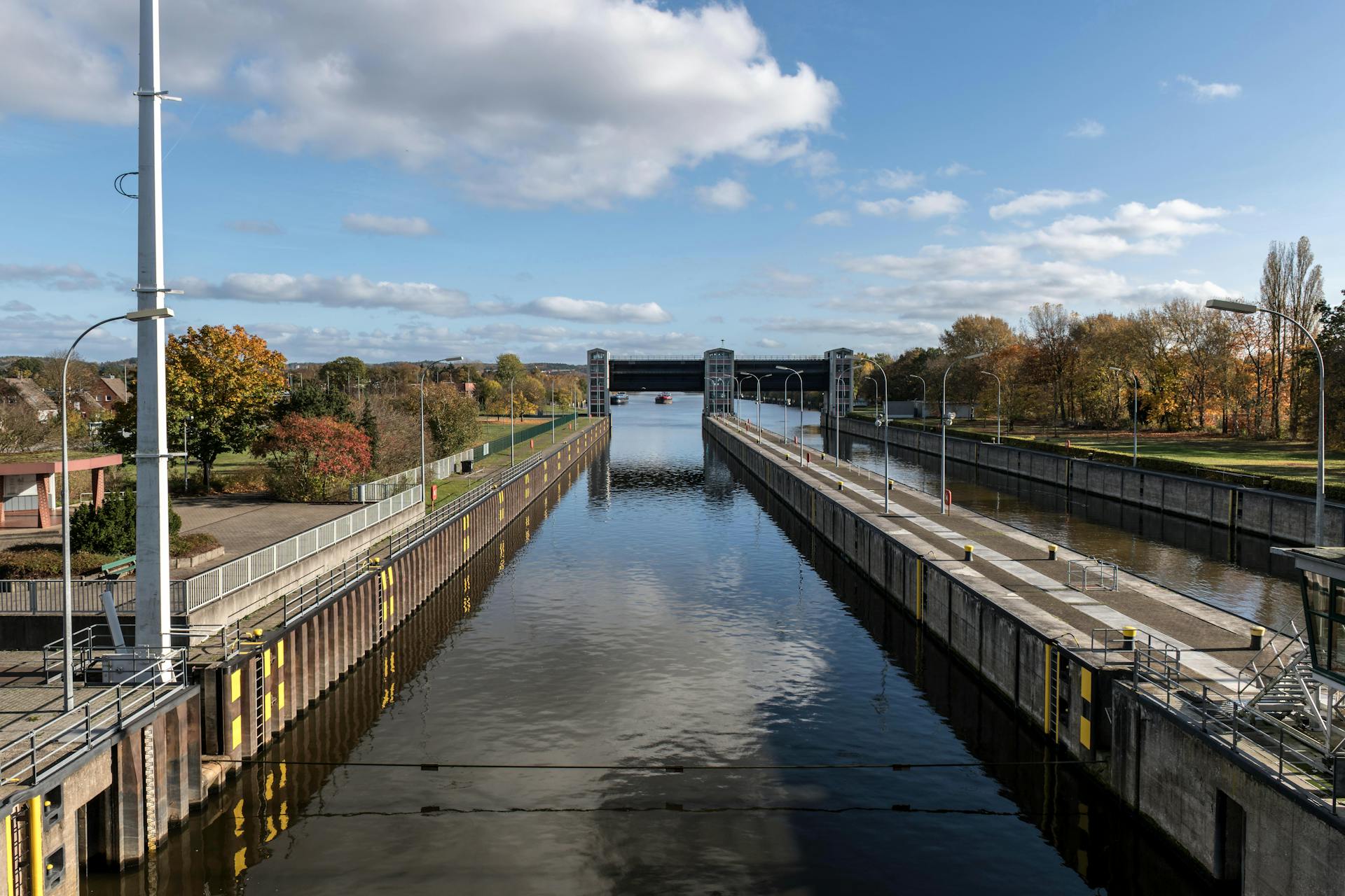 Peaceful autumn view of a canal lock in Geesthacht, perfect for travel and nature photography.