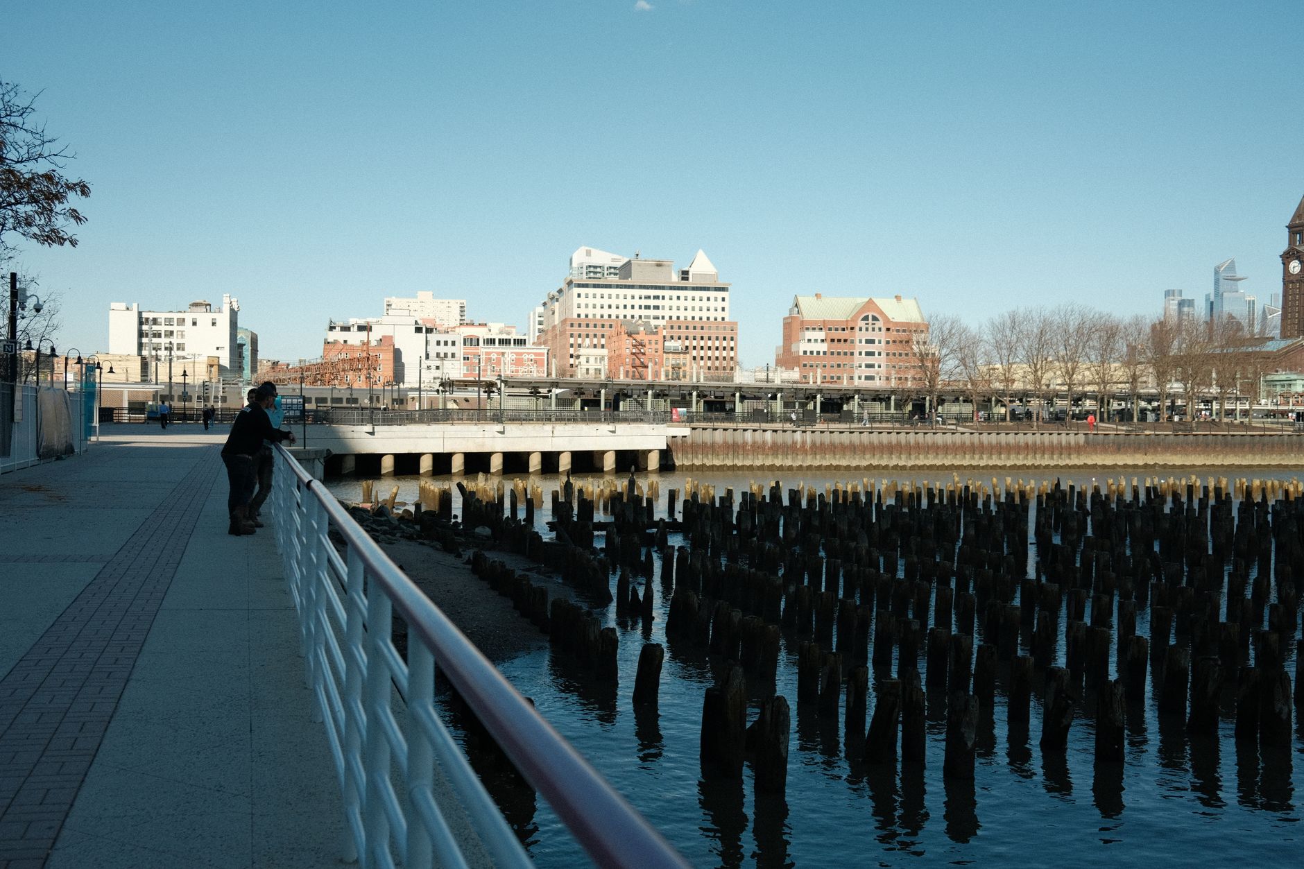 Explore the scenic Jersey City waterfront with this stunning view of the promenade and historic pier.