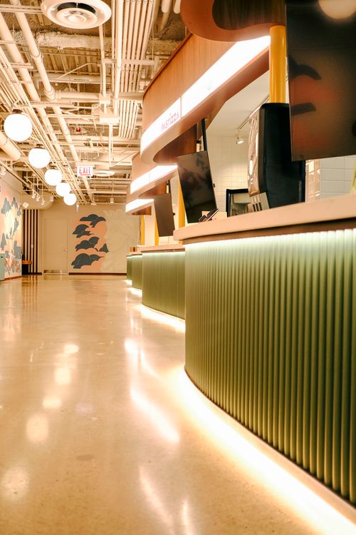 Free Bright and stylish office lobby featuring modern decor and geometric patterns. Stock Photo