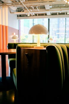 A warm and inviting restaurant interior featuring modern decor and ambient lighting, perfect for a cozy dining experience.