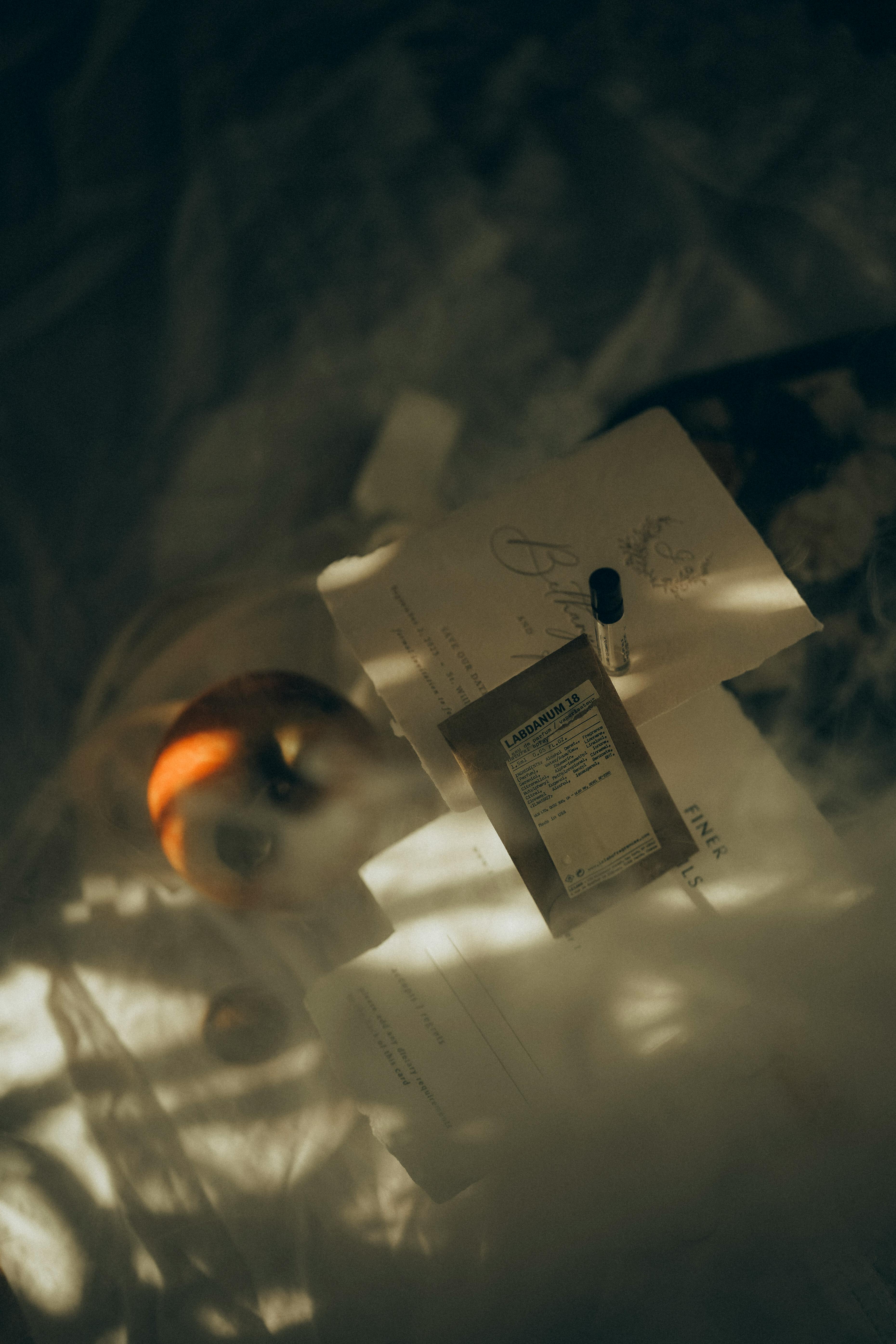 Free Moody flat lay capture of stationery on a desk, bathed in soft, diffused light. Stock Photo