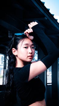 Stylish young woman showcasing urban fashion in Atlanta street setting.