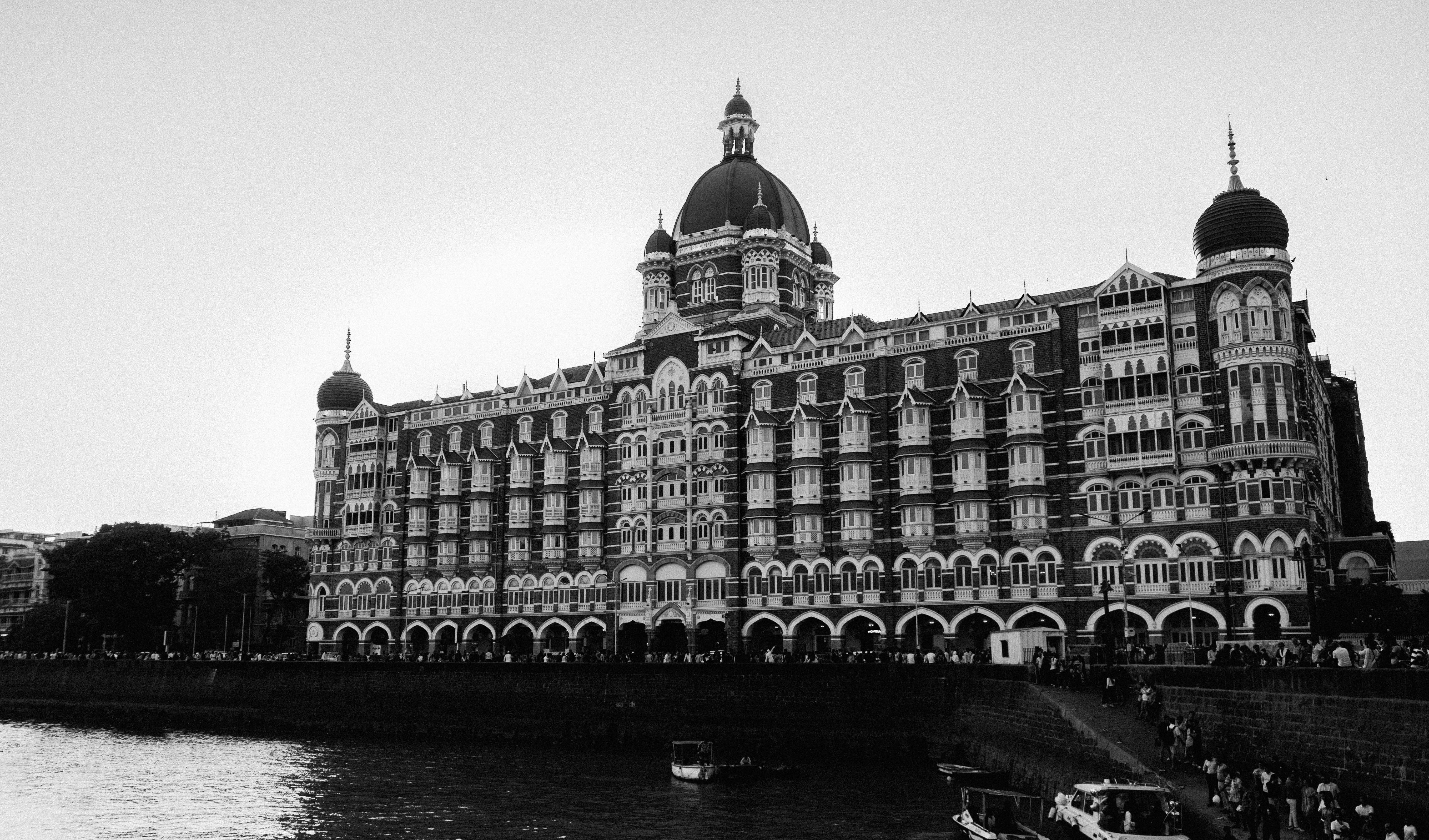 Free Black and white image of the Taj Mahal Palace Hotel, Mumbai's architectural landmark. Stock Photo