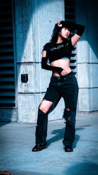 A stylish model poses in a city street wearing trendy Y2K fashion, showcasing a modern aesthetic.