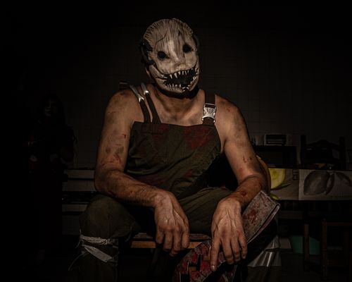 Free Dramatic portrait of a person wearing a terrifying horror mask and costume, perfect for Halloween themes. Stock Photo