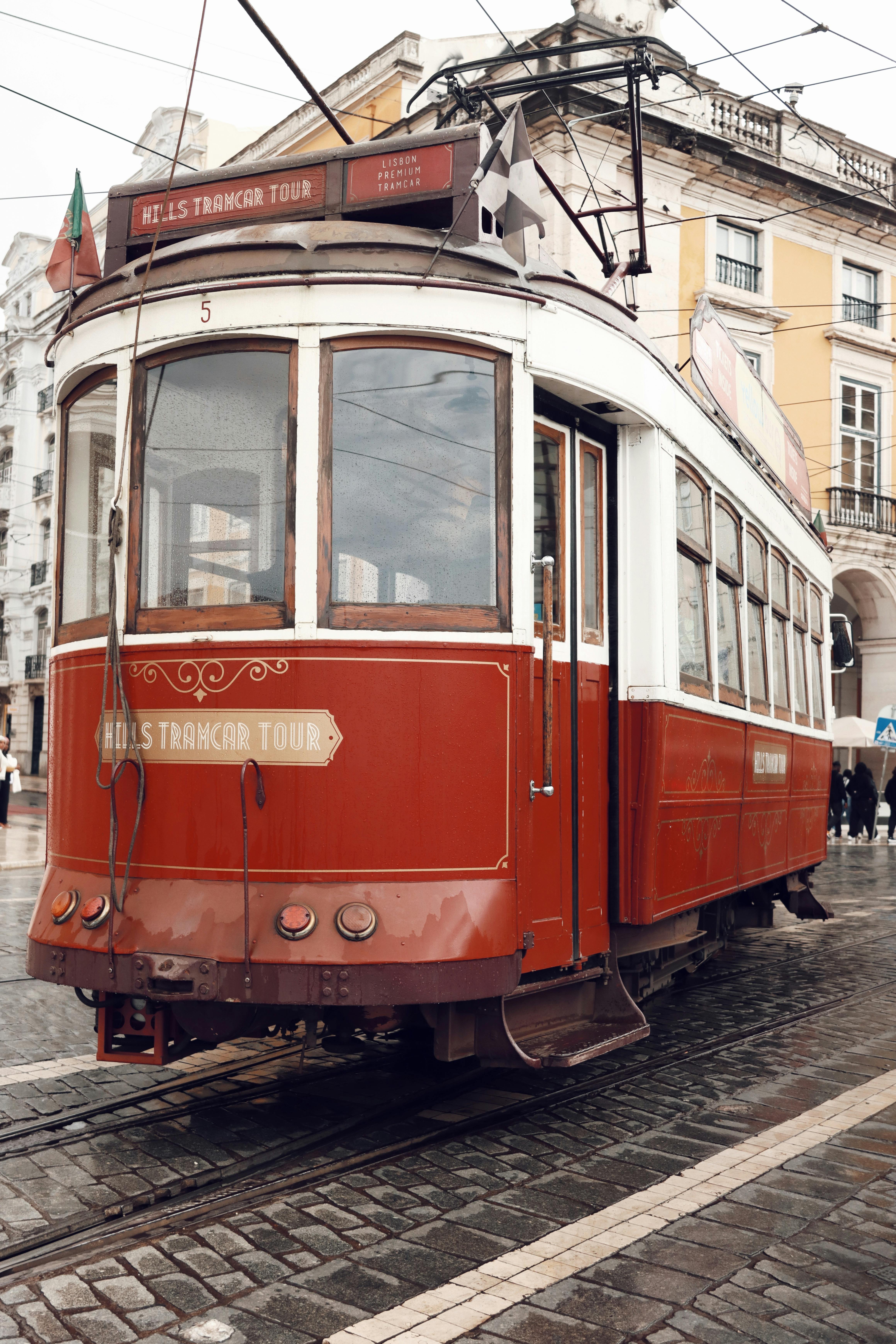 historic red tram in central lisbon portugal