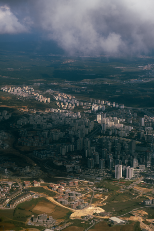 Free A dramatic aerial view of Istanbul's urban landscape under cloudy skies, showcasing its unique cityscape. Stock Photo