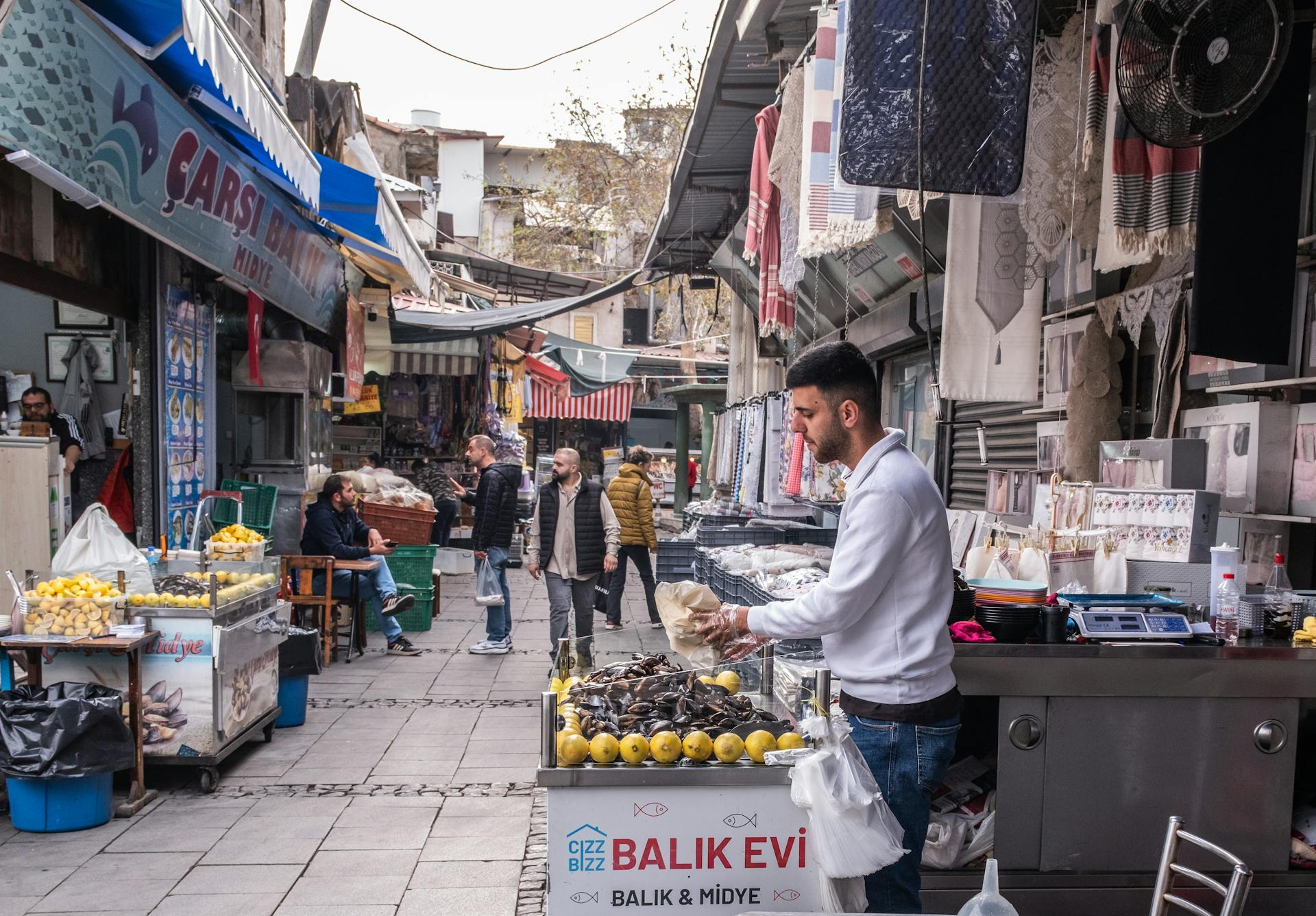 Explore the lively atmosphere of Kemeraltı Bazaar with bustling stalls and local vendors in Izmir.