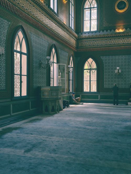 Free Interior of a historic Ottoman building in Istanbul, showcasing intricate designs and high arched windows. Stock Photo