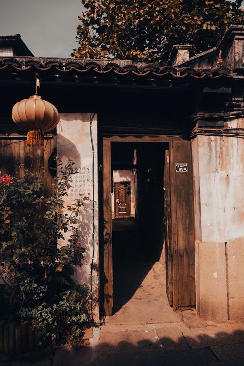Free Rustic Chinese courtyard with lantern, evoking a historic ambiance. Stock Photo