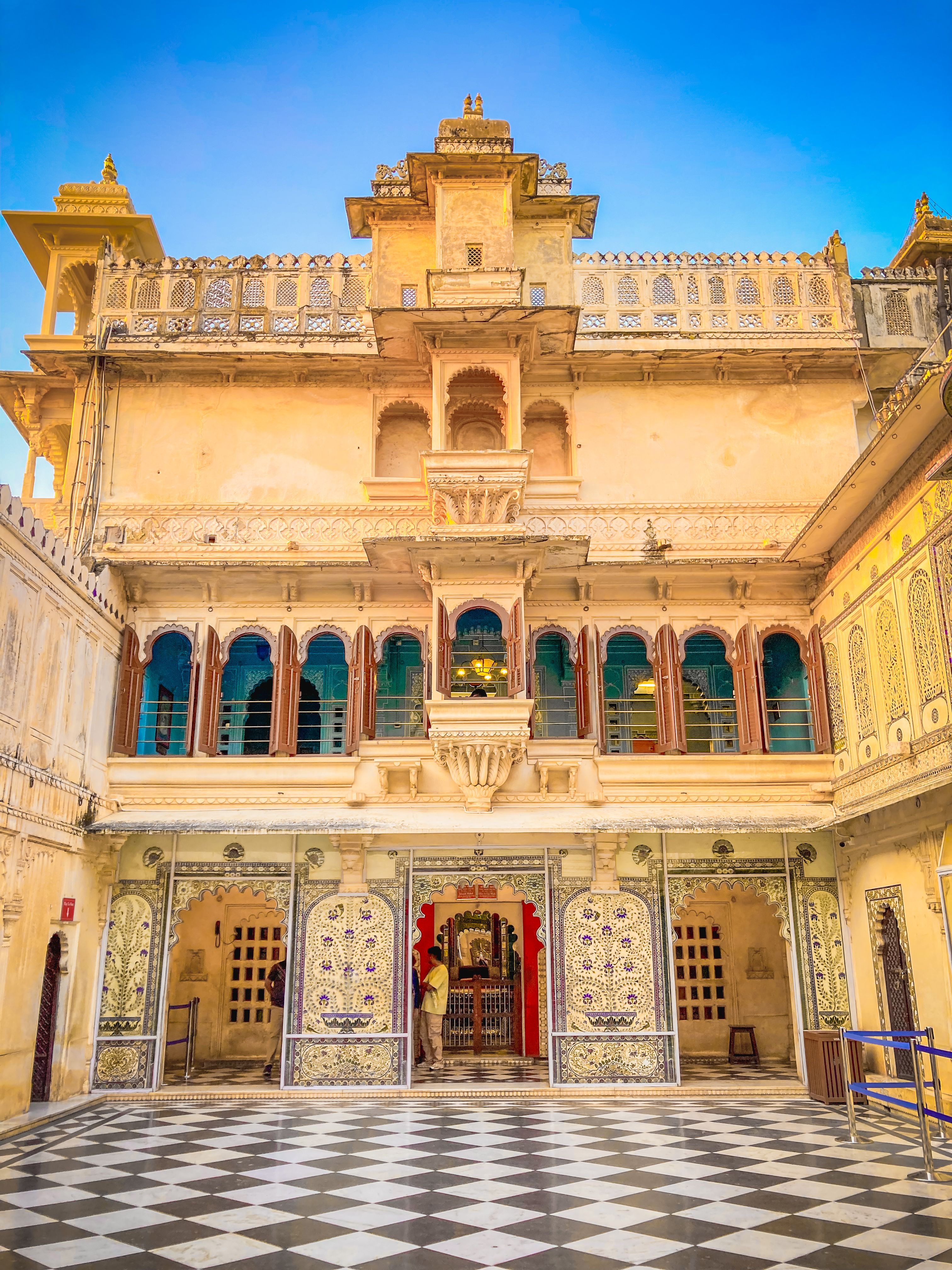 Stunning architecture of the Udaipur City Palace courtyard, showcasing Indian heritage.