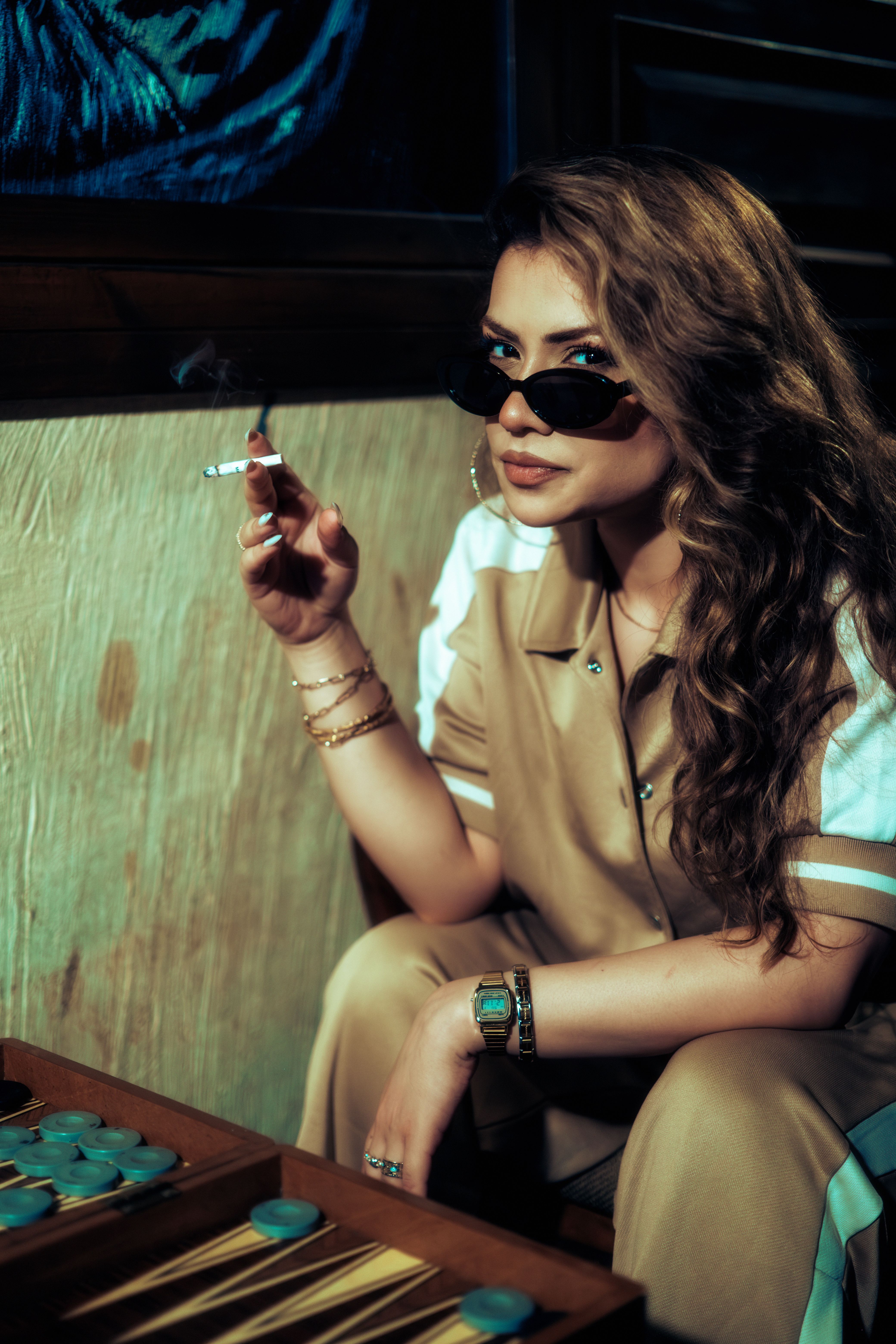 stylish cigarette Stylish Woman Relaxing with a Cigarette Indoors · Free Stock Photo