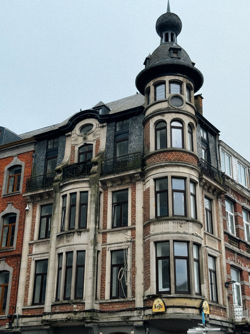 Free Charming architecture of a historic building with a unique turret in Dinant, Wallonia, Belgium. Stock Photo