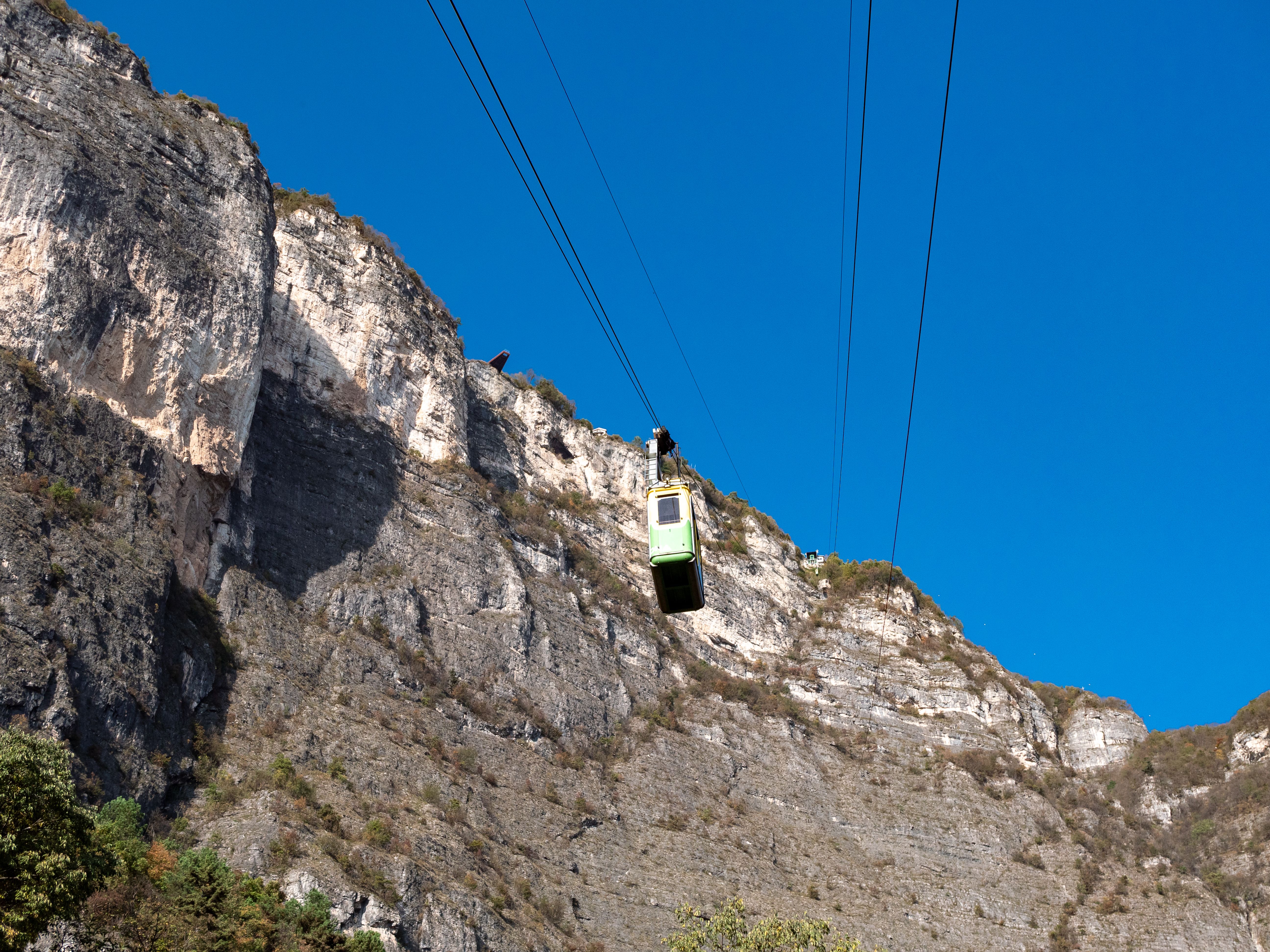 Mountain Cable Car Amidst Rugged Cliffs · Free Stock Photo