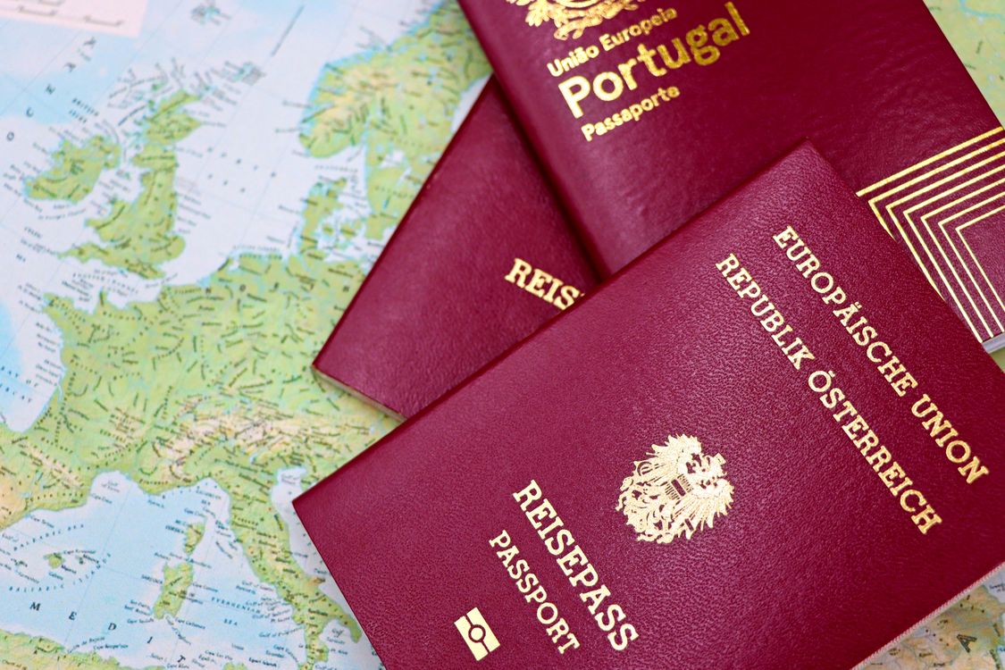 European passports on a world map representing global immigration and travel