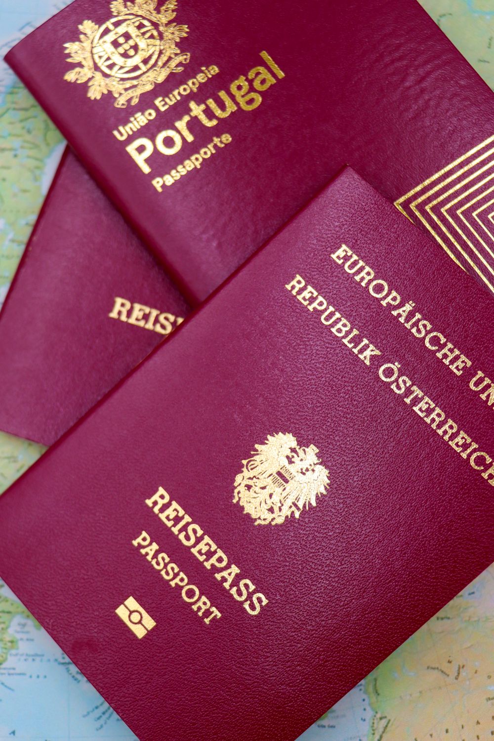 National passports laid over a world map