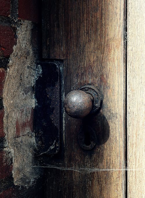 Free Door Knob on an Old Wooden Door Stock Photo