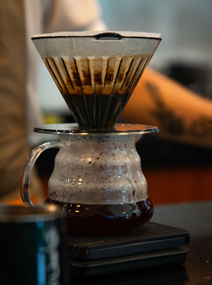 Filter coffee brewing into a glass server on a scale — photo by Dann Lamadrid on Pexels