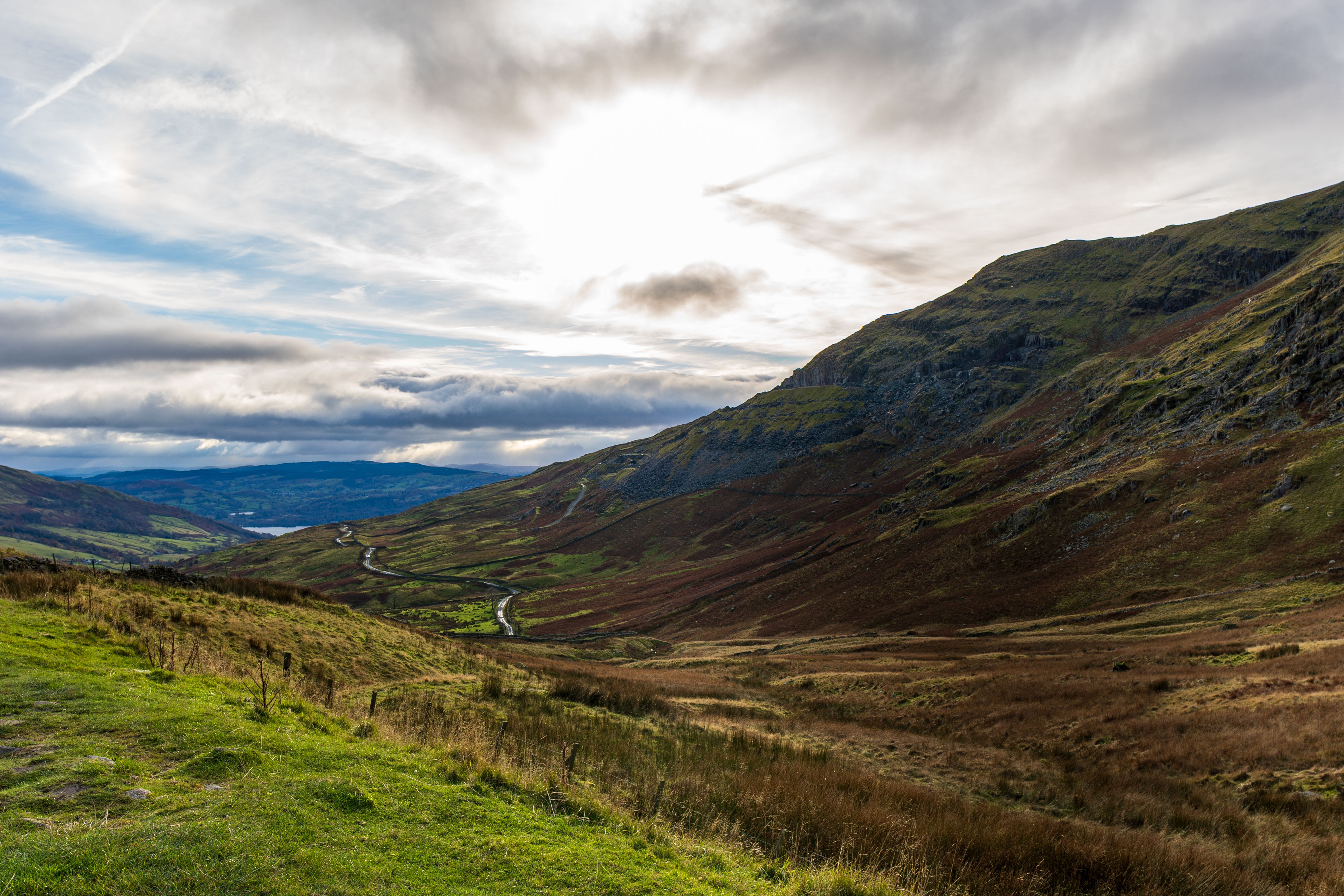 Scenic Mountain Landscape with Winding Road · Free Stock Photo