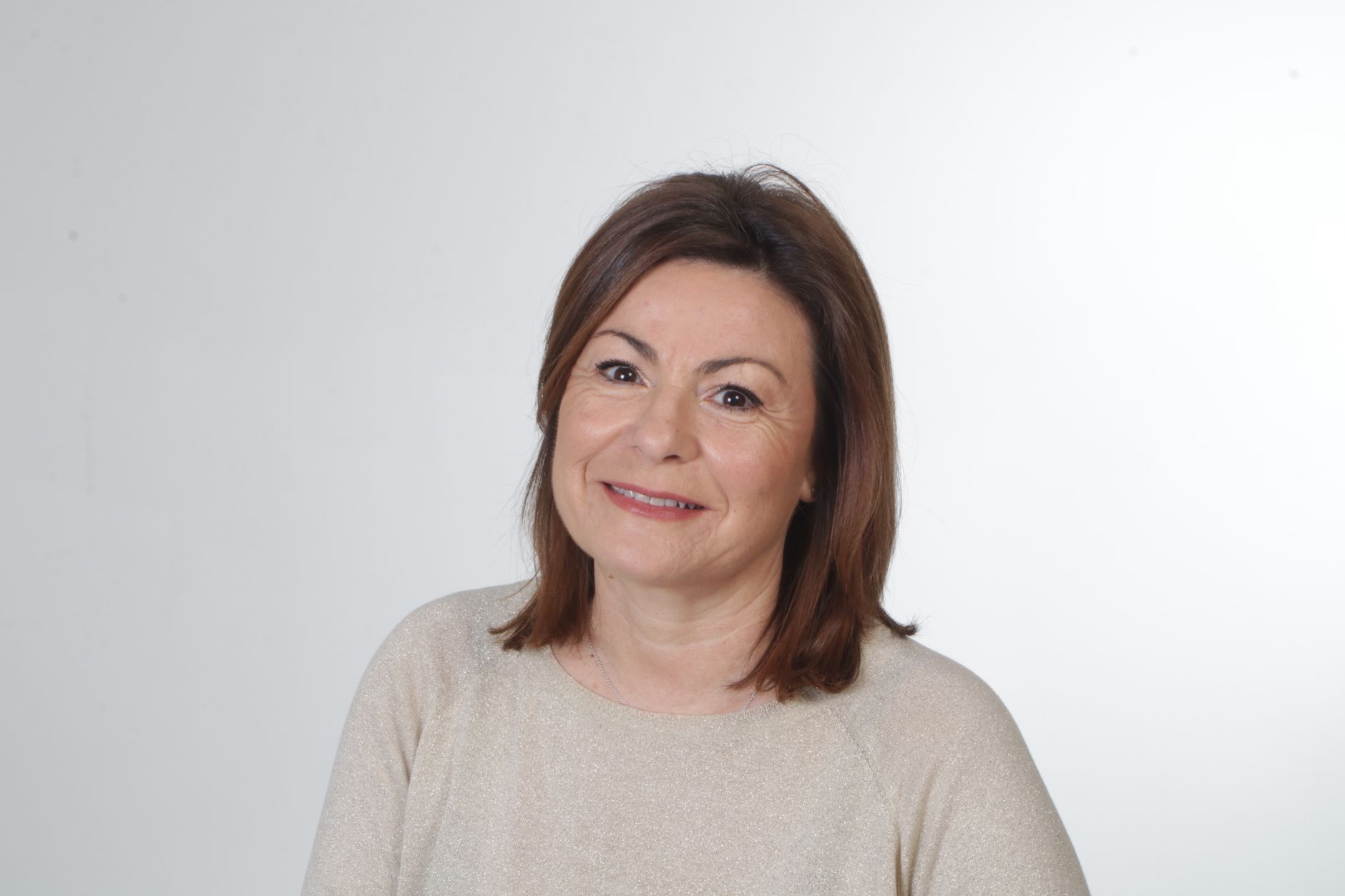 A coach photographed in natural light against a plain background