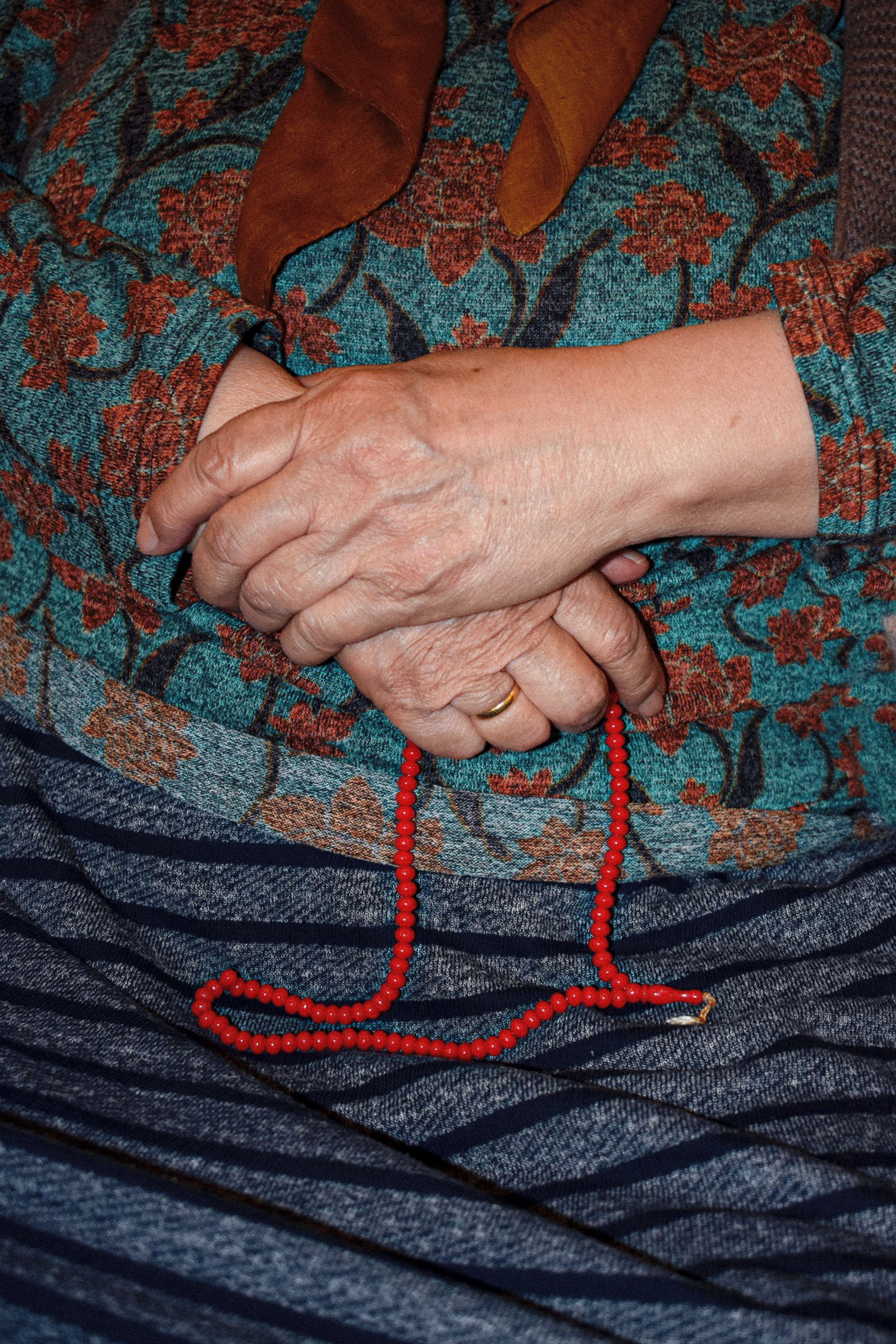 Elderly Hands Holding Red Prayer Beads · Free Stock Photo