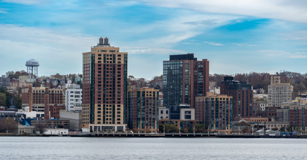 Explore a modern city skyline along the waterfront, a perfect urban landscape.