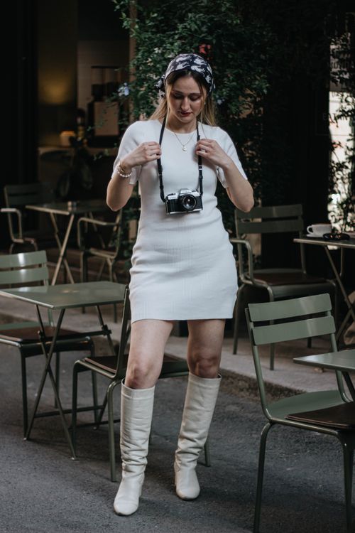 Free A fashionable woman explores Istanbul with a vintage camera on a cozy street. Stock Photo